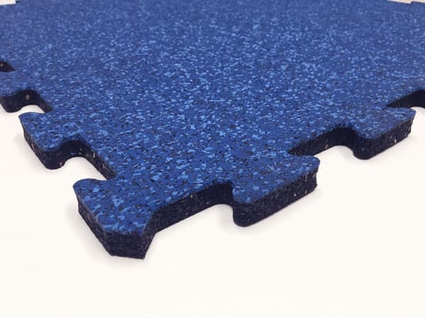 Performance-Lock rubber floor tile shown in close-up with interlocking edges and blue fleck surface