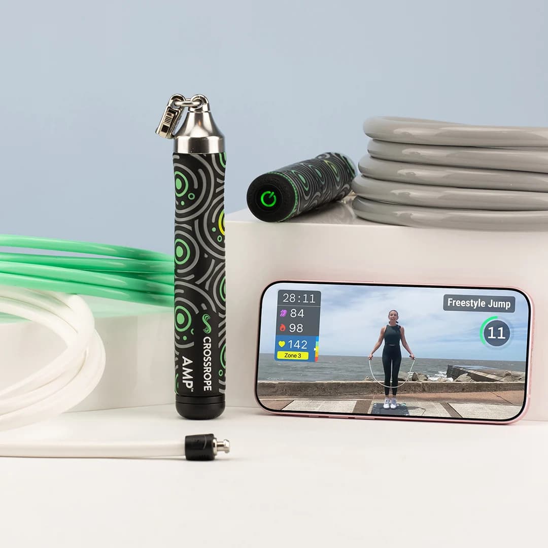 Crossrope AMP handle, interchangeable ropes, and phone showing a jump session