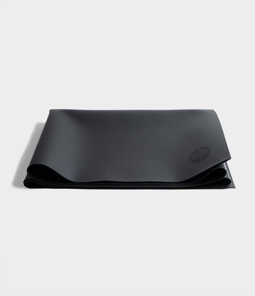 Manduka GRP Adapt Travel Mat shown flat as a thin portable floor station