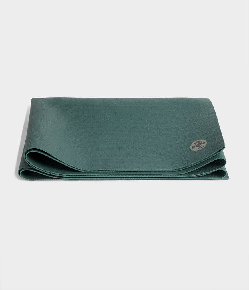 Manduka PRO Travel Yoga Mat 2mm folded in Black Sage on a light background