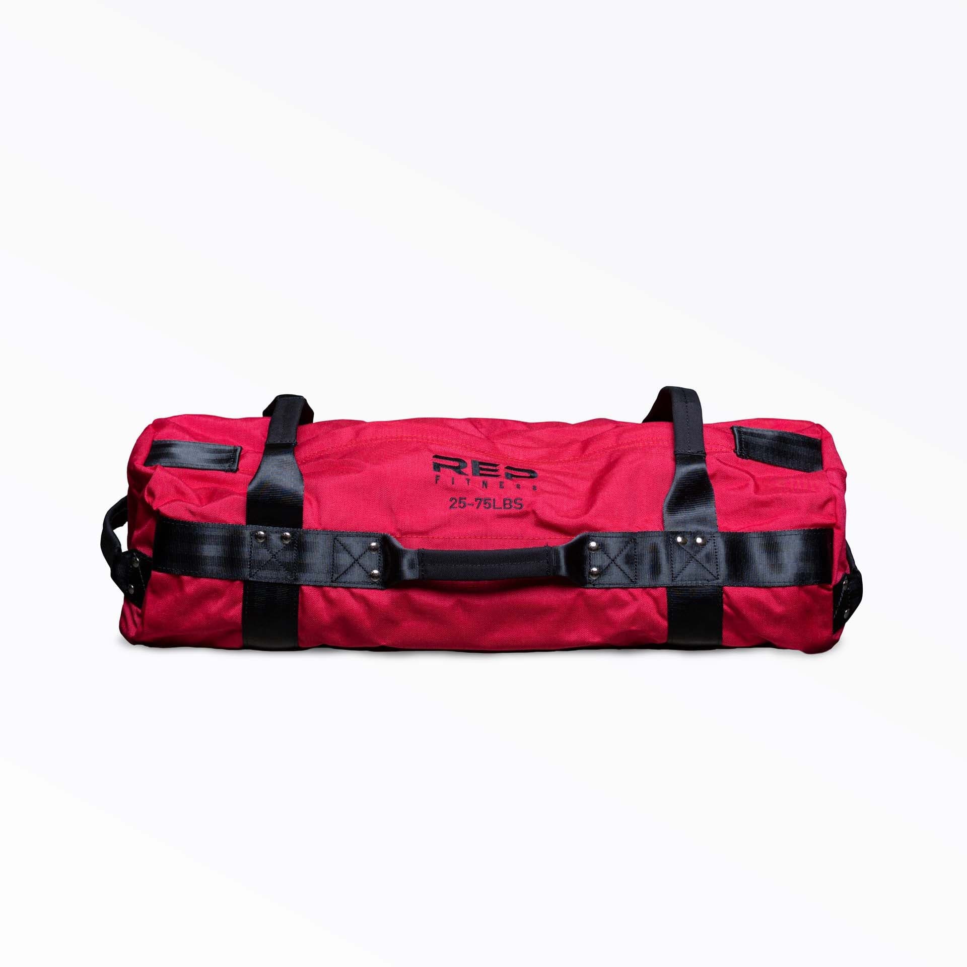 REP Fitness Sandbag shown in a red 25 to 75 pound configuration with multiple webbing handles