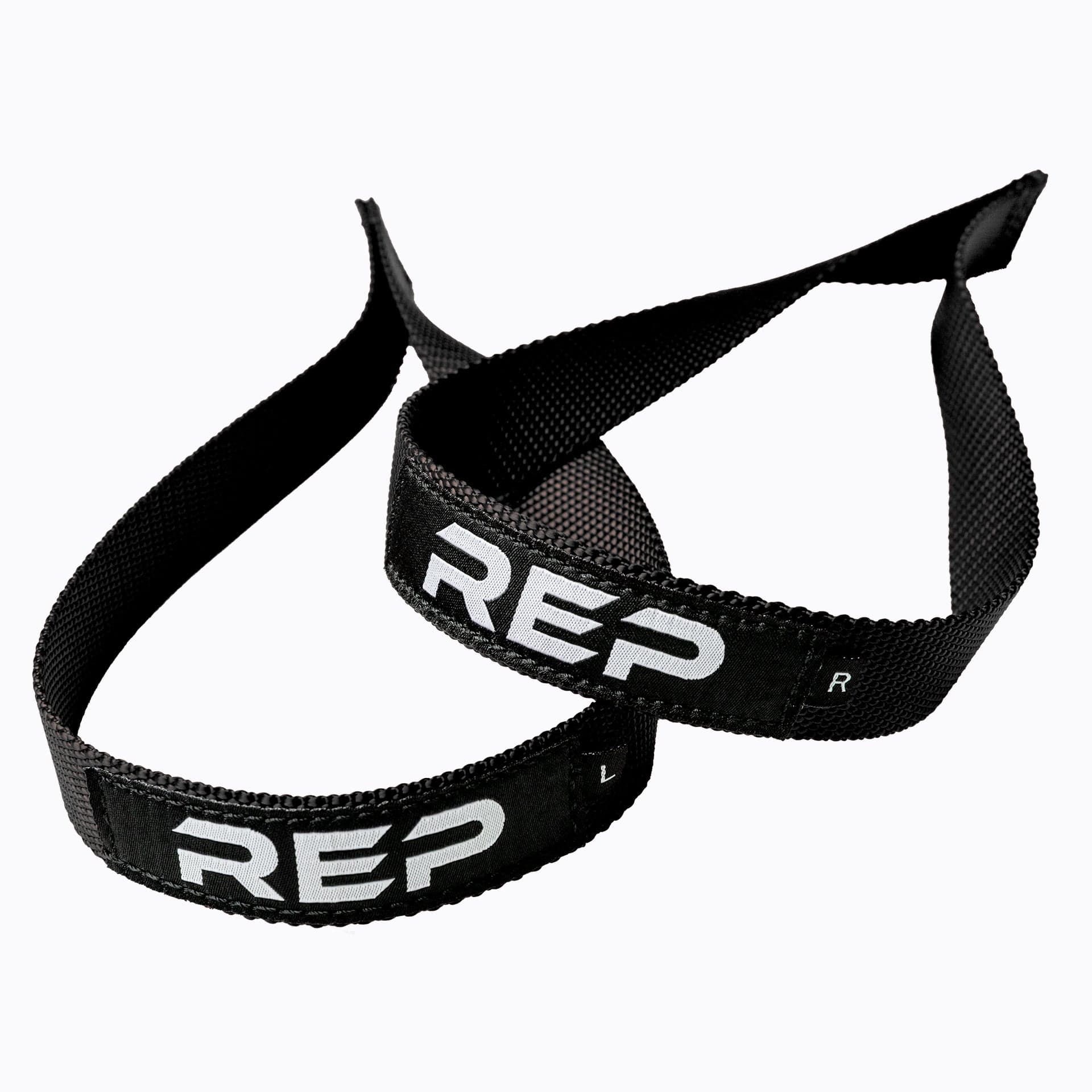 REP Olympic Lifting Straps shown as a pair of short closed-loop straps beside a barbell