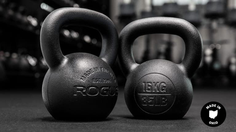 Rogue Powder Coat kettlebells shown together with their textured black finish and flat bases