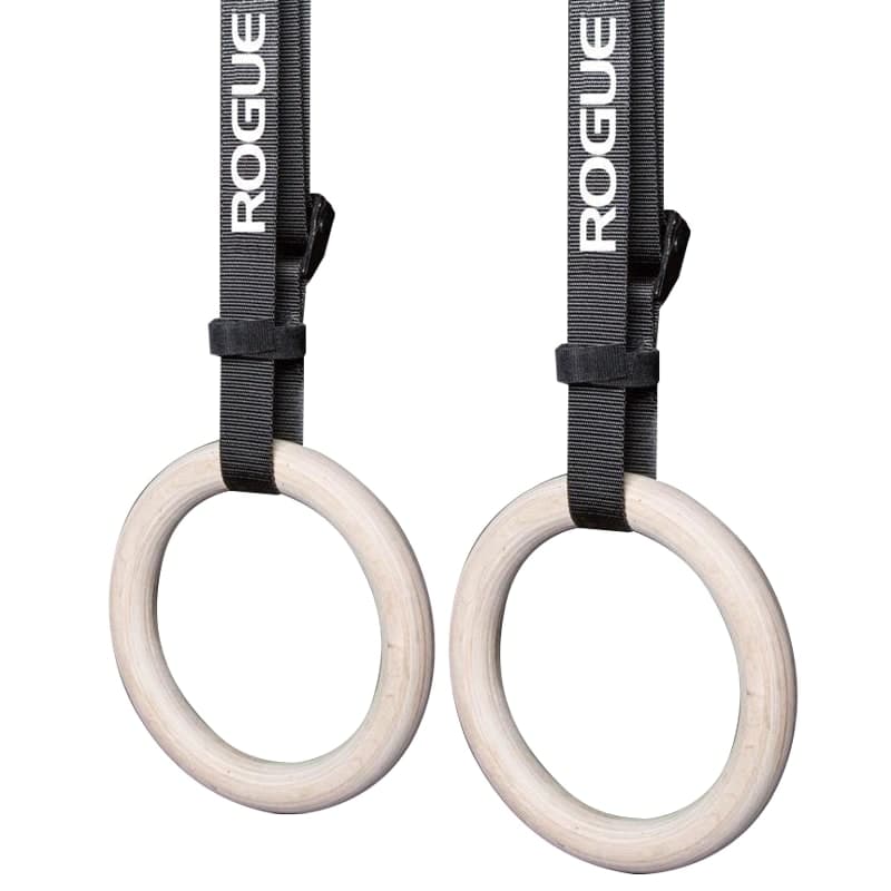 Rogue Wood Gymnastic Rings shown as a pair of light wood rings with black adjustable straps