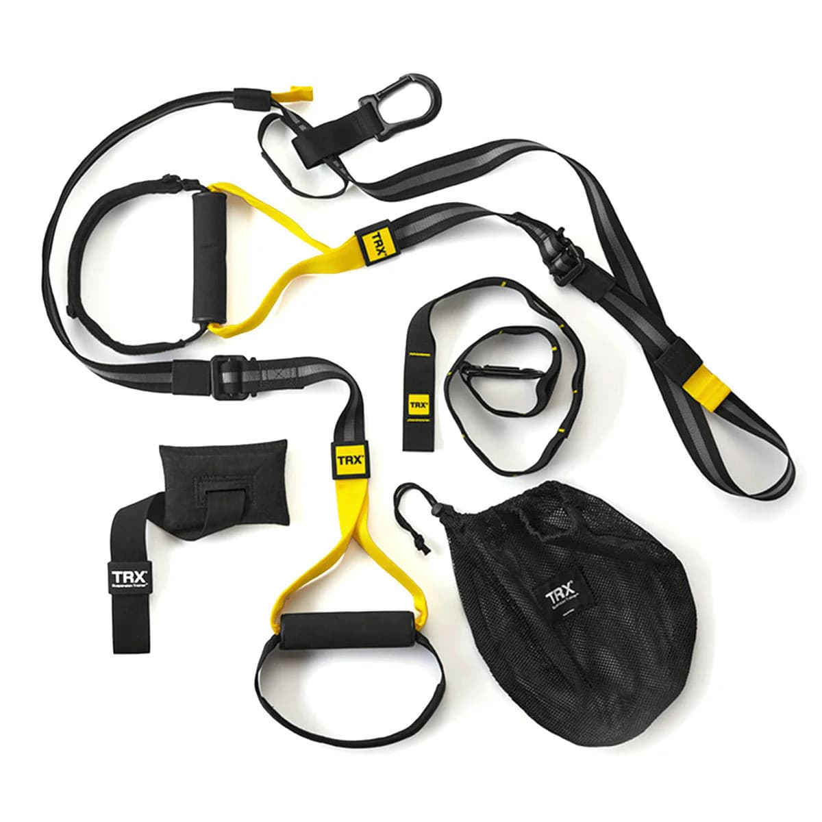 TRX HOME2 SYSTEM suspension trainer arranged with straps, anchors, handles, and storage bag